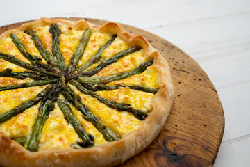 Asparagus and goat cheese tart on a puff pastry base.