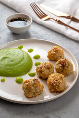 Fish meatballs with broccoli puree. Proper nutrition concept. Diet dish. Vegetarian food.