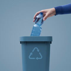 Woman putting a plastic bottle in a trash bin