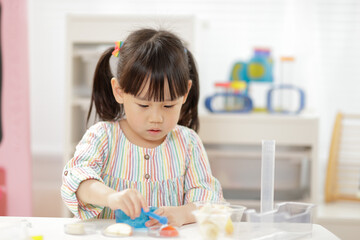 young  girl  play science experiments for home schooling