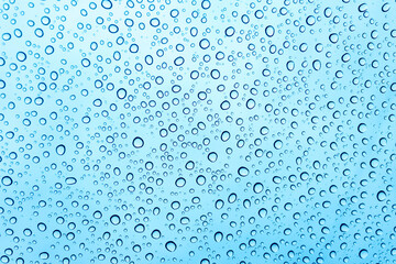 Rain drops on the car windshield after raining in rain season