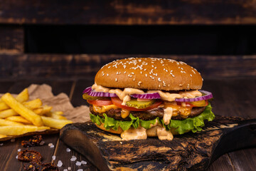 Delicious grilled burger. Beef burgers on wooden plate.