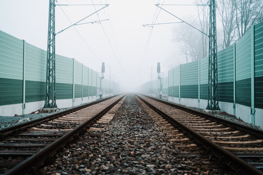 Railroad noise barrier. Acoustic wall reducing train sound. Soundproof protection fence along the railway.