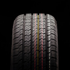 all-season new tire square close-up photo on a black background