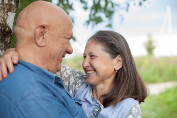 Fototapeta premium Portrait of caucasian senior couple in park