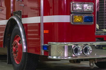 header

  Fire truck headlights.  Yellow and blue headlights of a fire truck.  Front view of the fire engine cabin.