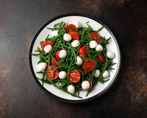 Fresh Samphire salad with cherry tomatoes and mozzarella. Healthy food.
