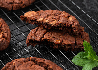Chocolate, orange chip cookies on cooling rack