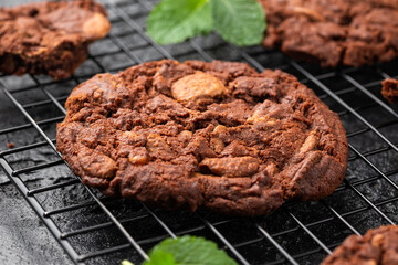 Chocolate, orange chip cookies on cooling rack