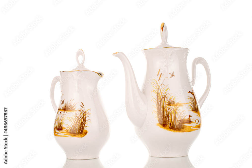 Wall mural One ceramic teapot and milk jug, close-up, isolated on a white background.