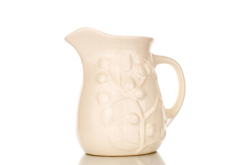 One ceramic milk jug, close-up, isolated on a white background.
