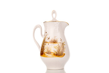 One ceramic milk jug, close-up, isolated on a white background.