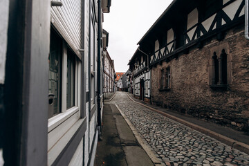 Fototapeta na wymiar View on timbered houses and cobbled street in the historic old town of Goslar, Germany