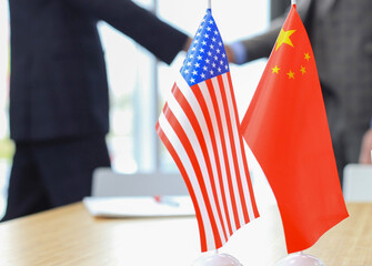 American and Chinese leaders shaking hands on a deal agreement