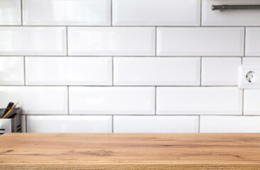Wood table top on blur kitchen window background - can be used for display or montage your products (or foods)