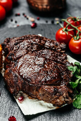 Steak Ribeye Black Angus medium rare beef with spice. vertical image. top view. place for text