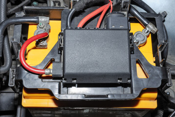 Car battery in the engine compartment