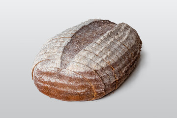 Oval loaf of bread with cumin, cut into slices