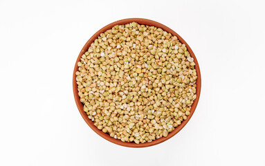 Buckwheat groats in bowls and bags isolated on a white background. High quality photo