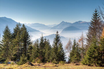 Under the morning mist lies the picturesque landscape of the entire Inn Valley. One looks down on the town of Telfs in Tyrol and the mountains of the Mieming chain.