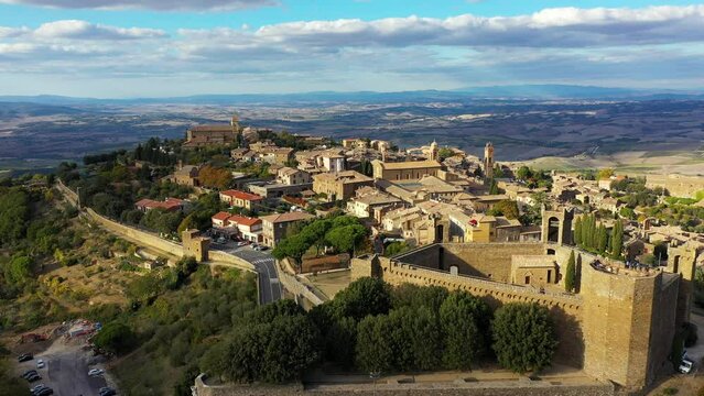 View of Montalcino town in Val d'Orcia, Tuscany, Italy. The town takes its name from a variety of oak tree that once covered the terrain. View of the medieval Italian town of Montalcino. Tuscany