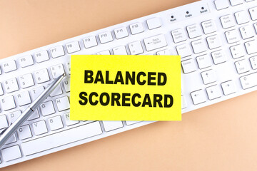 Text BALANCED SCORECARD text on a sticky on keyboard, business concept