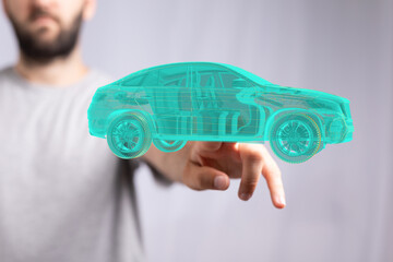 Man holding and touching holographic smart car