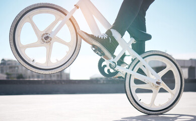 Fototapeta premium Trickin. Cropped shot of an unrecognizable man riding his BMX outside.
