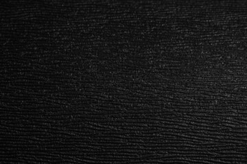 Black coarse texture. Black plastic background