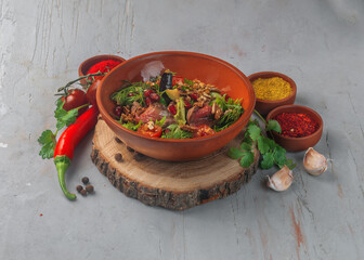 vegetable salad with roast beef on gray background