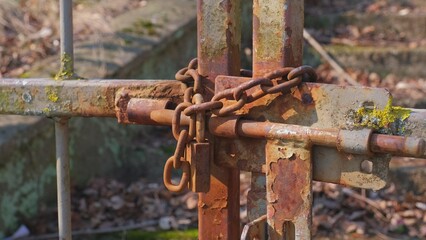 Metal Fence Gate Secured with Sliding Bolt Rusty Chained and Padlock