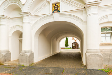 Gate of white stone building in Valaam monastery, Russia