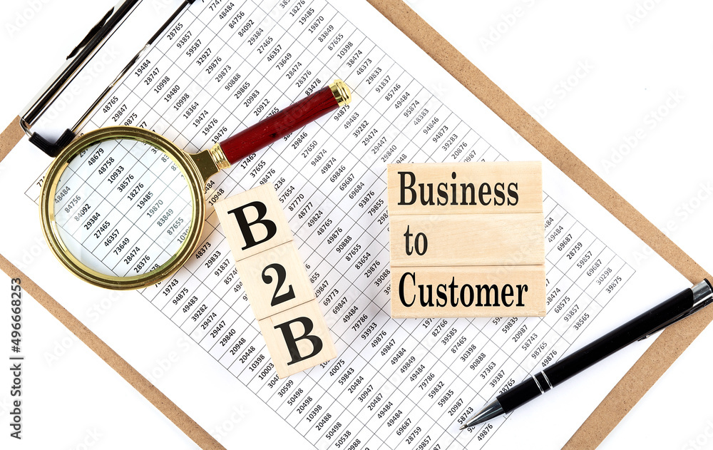 Poster b2b text on wooden block on chart background