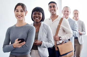 This could change our lives. Shot of a group of new employees waiting in a line to complete their...