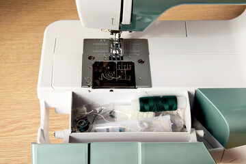 Modern sewing machine. View from above