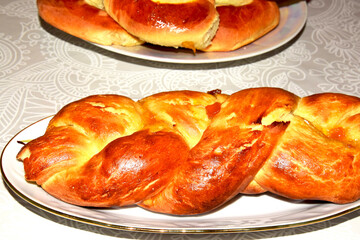 Wicker bun made of white bread on the table