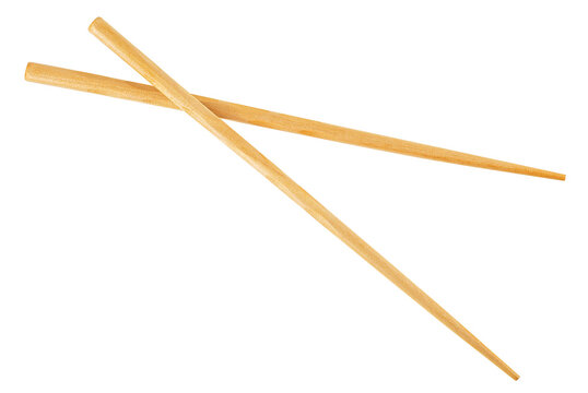 Pair of wooden chopsticks isolated on a white background, top view.