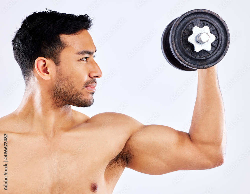 Poster use high quality equipment. shot of a young man flexing his bicep muscles while holding a weight aga