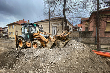 Fototapeta premium Reconstruction of the street with the use of excavators