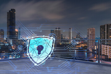Rooftop with concrete terrace, Bangkok night skyline. Cyber security concept to protect clients confidential information. IT hologram padlock icons. City downtown. Double exposure.