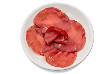 Bresaola Della Valtellina - Italian air dried beef slices in white plate isolated on white with clipping path