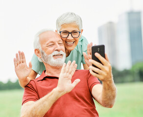 woman man outdoor senior couple phone online communication senior call video elderly phone mobile smartphone communication active conference retirement