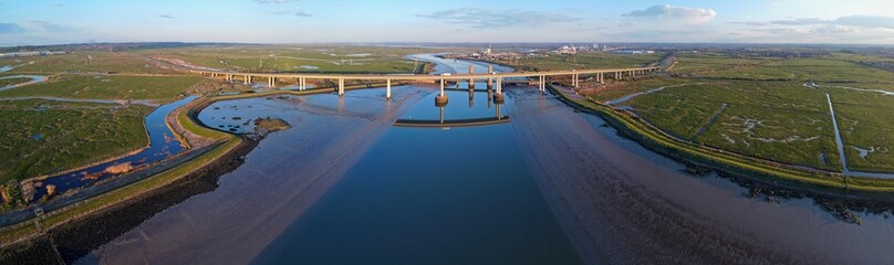 Aerial drone view of Kingsferry Bridge or Sheppey Crossing, double motor and rail bridge connecting Kent and Swale with the Isle of Sheppey in England