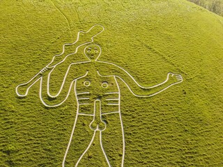 Aerial drone. Cerne Abbas Giant, Dorset. Hill figure carved out of chalk. 55 meters high. Depicts a...