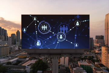 Glowing Social media icons on billboard over sunset panoramic city view of Bangkok. The concept of networking and establishing new connections between people and businesses in Southeast Asia