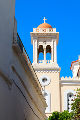 bell tower of the superb Saint Dimitrios church, in the village of Pyrgos, famous for its marble craftsmen, on the island of Tinos, in the Cyclades, in the heart of the Aegean Sea