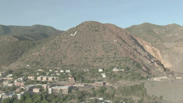 Aerial above town of Jerome Arizona in summer blue sky day