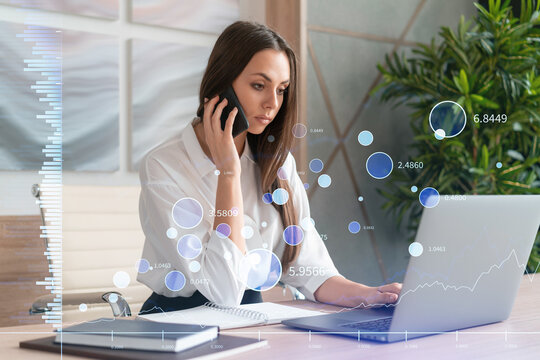 Attractive businesswoman in white shirt has conference call to optimize trading strategy at corporate finance fund. Forex chart hologram over office background
