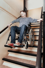 Fototapeta na wymiar Disabled man on wheel chair riding down the stairs