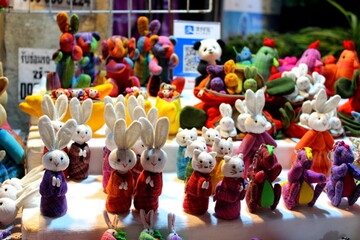 Stuffed decorative toys for sale displayed on counter